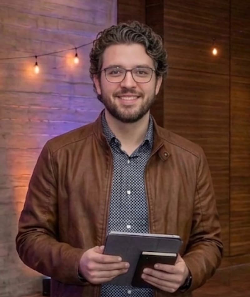 Attendee holding a branded Click & Catch photo keepsake at the LangChain × Tavily event